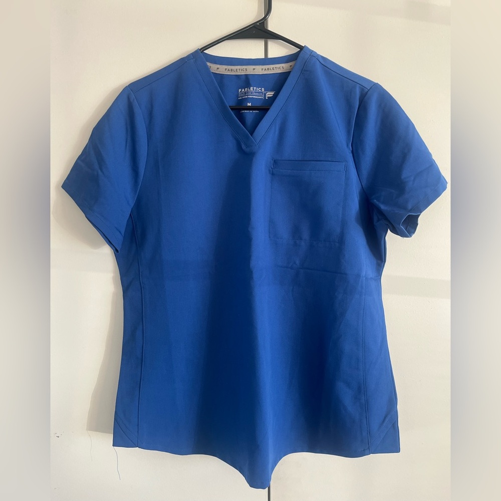 Fabletics Vital 1-Pocket Scrub Top 
Royal Blue Short Sleeve Tee
